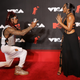 Nick Cannon and Ashanti on the 2021 MTV VMAs red carpet.